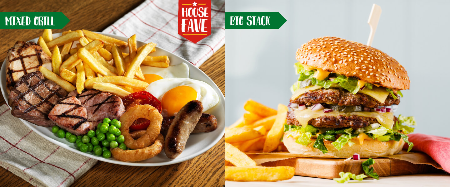  Brewers Fayre Mixed Grill on an oval plate including chicken, steak, gammon, sausages, a fried egg, onion rings, peas, a tomato and chips and a Brewers Fayre Big Stack burger with lettuce, red onion and cheese in a sesame bun next to chips on a wooden board.