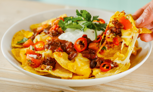 Loaded nachos served on a plate